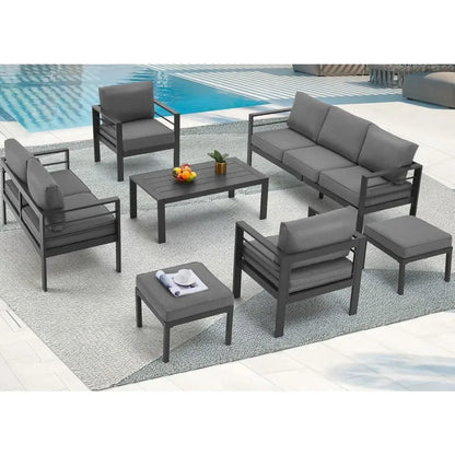 Seven piece aluminum patio furniture set with a coffee table